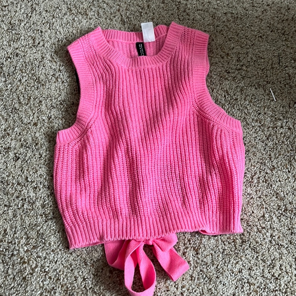 pink knit top with back hole